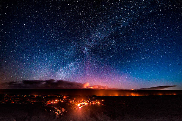 Hawaii lava flow under starry night sky